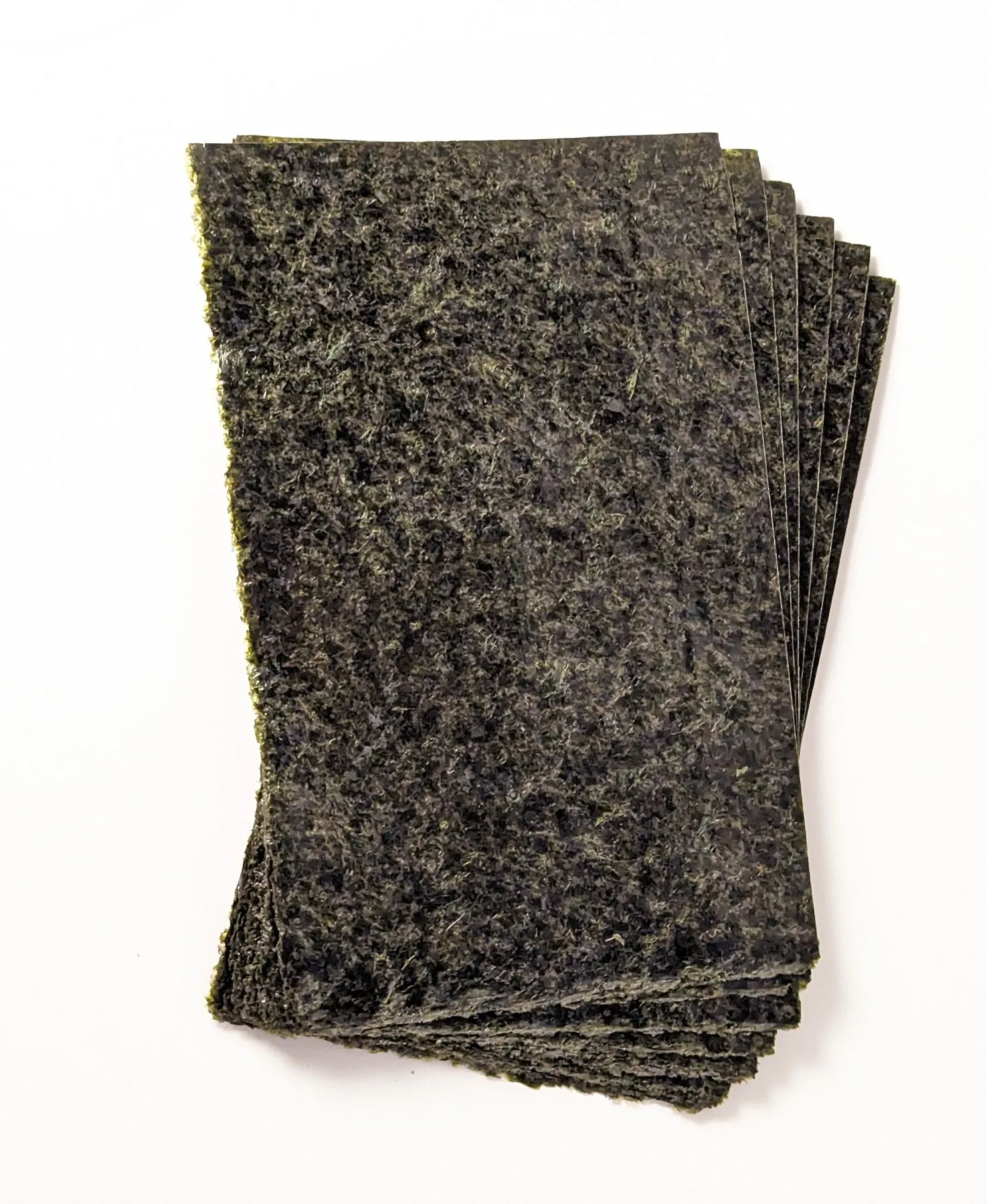 Stack of thick nori seaweed sheets for aquarium fish